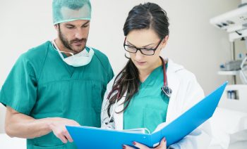 Medical team workers examining a medical report